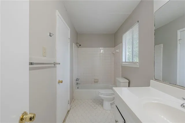 a view of a bathroom with a window and a shower
