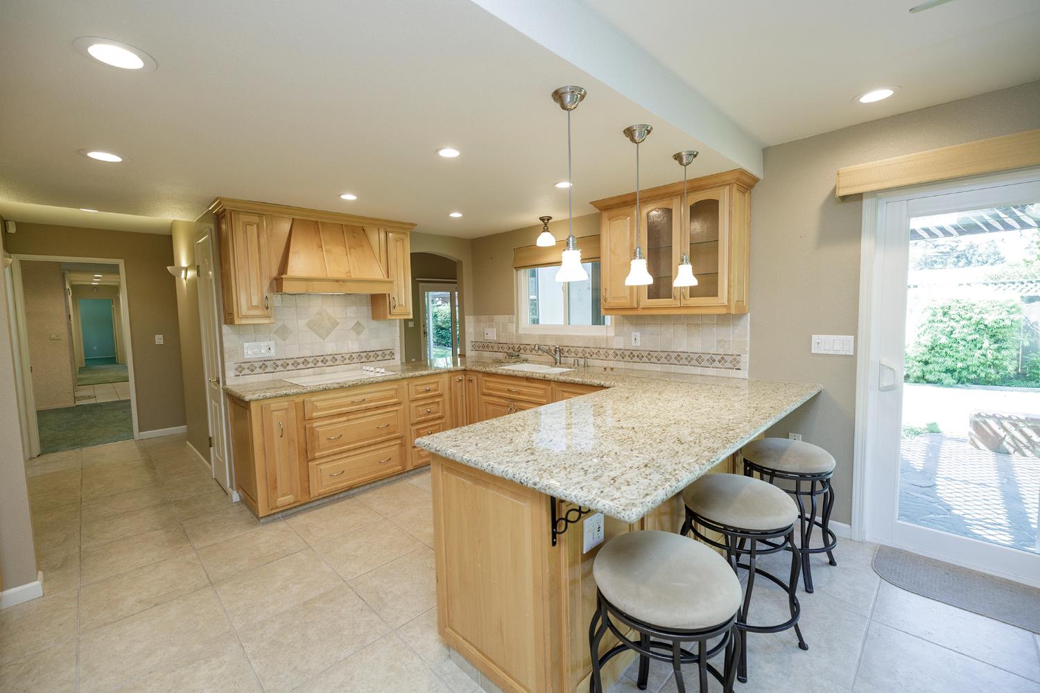 1001 Winsted Lane Modesto, CA 95355 - Photo 17 of 45 a kitchen with a table and chairs in it