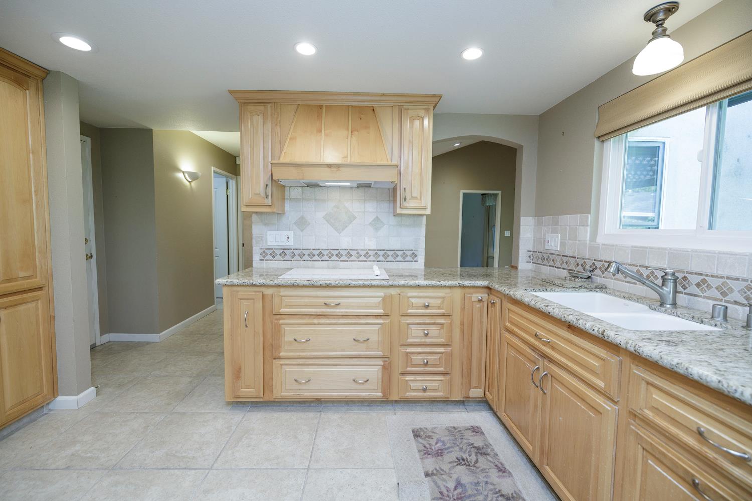 1001 Winsted Lane Modesto, CA 95355 - Photo 18 of 45 a bathroom with a granite countertop sink a mirror and a