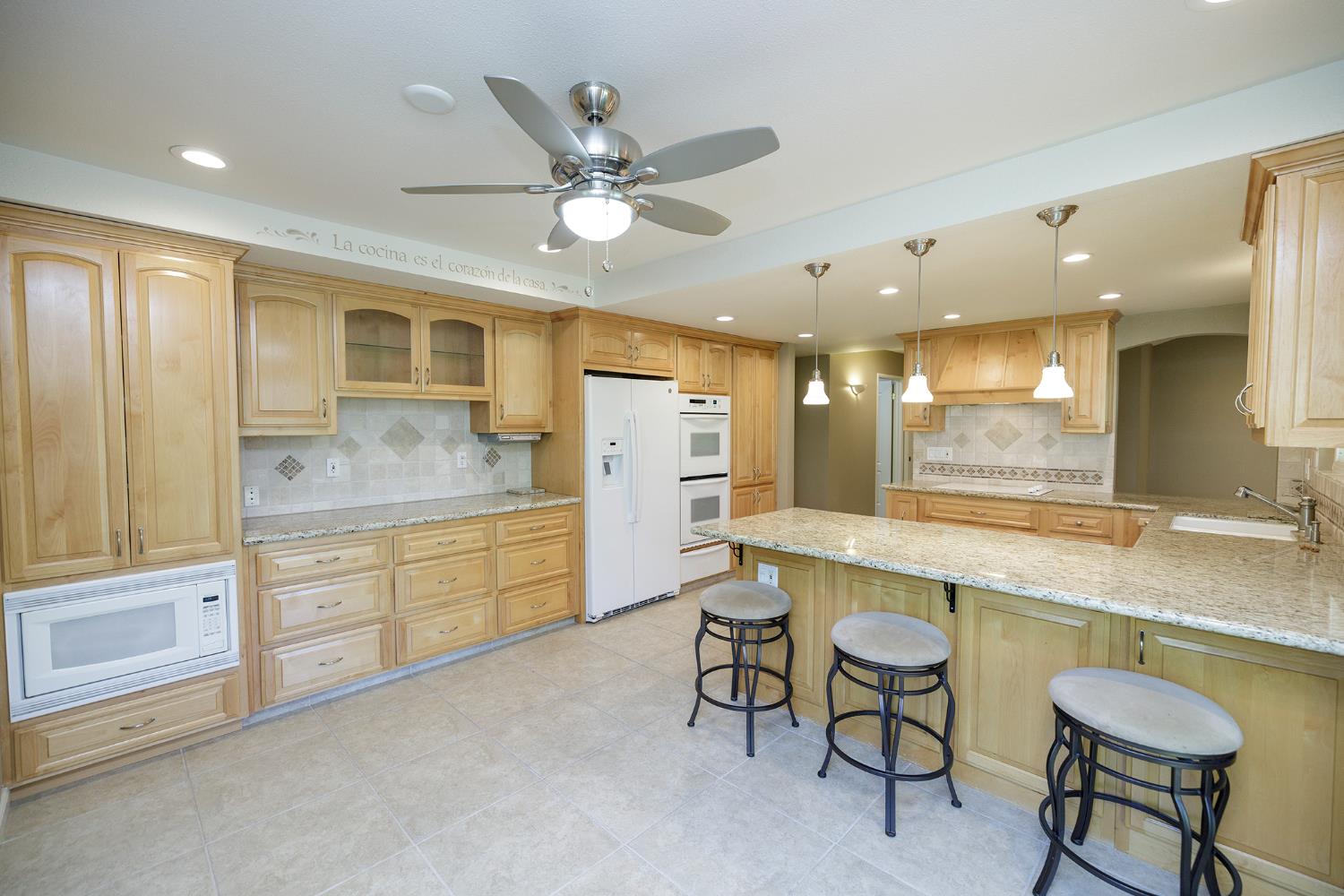 1001 Winsted Lane Modesto, CA 95355 - Photo 20 of 45 a large kitchen with a large window and stainless steel appliances