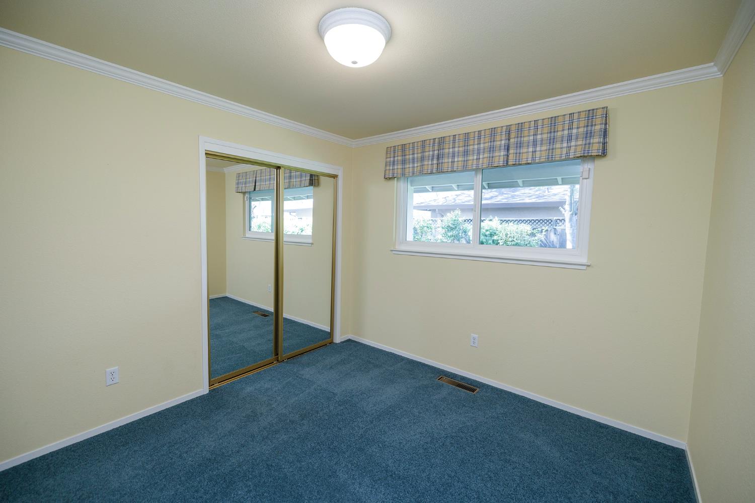 1001 Winsted Lane Modesto, CA 95355 - Photo 33 of 45 an empty room with windows