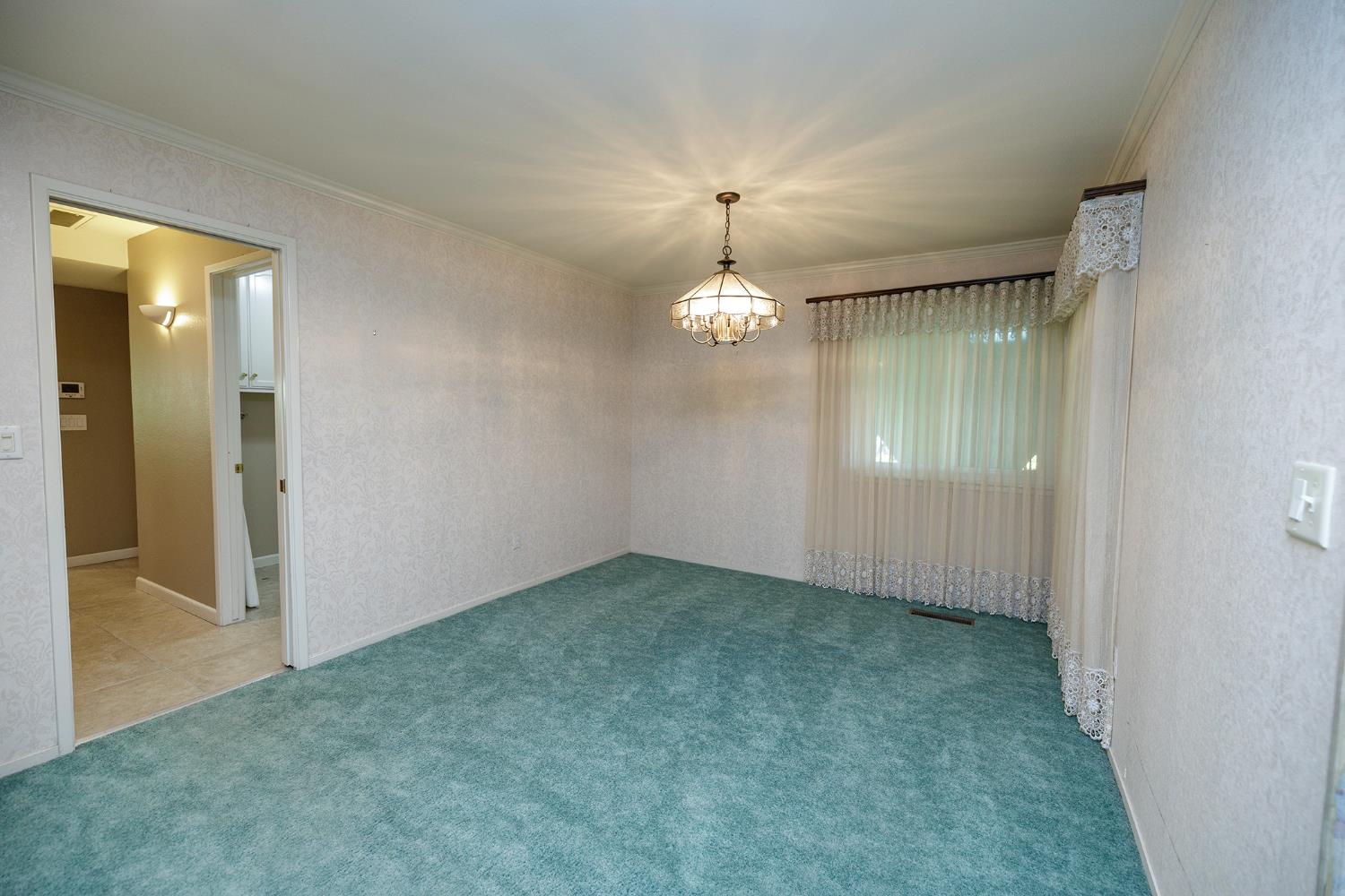 1001 Winsted Lane Modesto, CA 95355 - Photo 9 of 45 an empty room with a bathroom