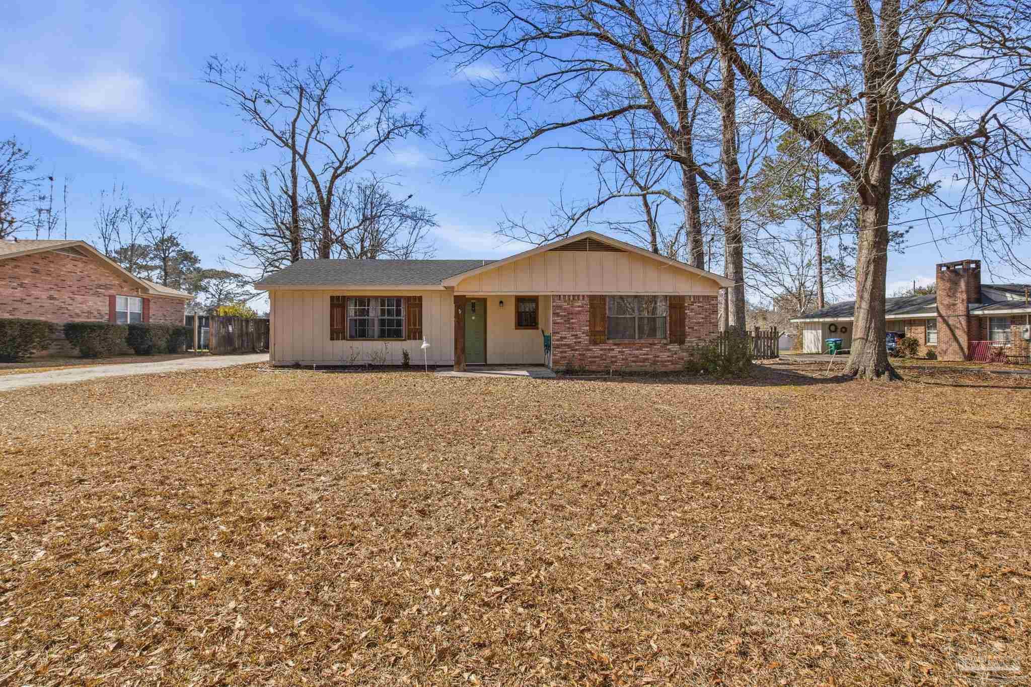 104 Thorndale Place Atmore, AL 36502 - Photo 1 of 39 a front view of a house with a yard