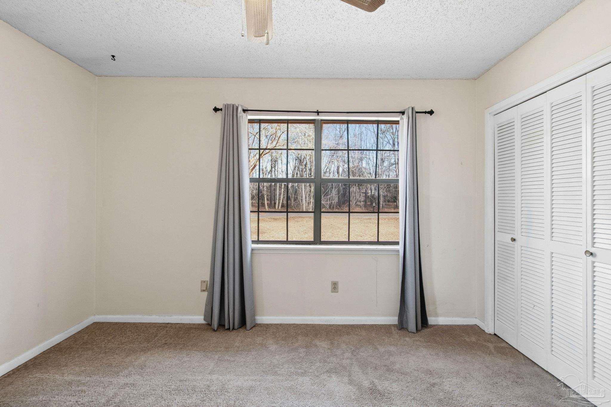104 Thorndale Place Atmore, AL 36502 - Photo 18 of 39 an empty room with windows