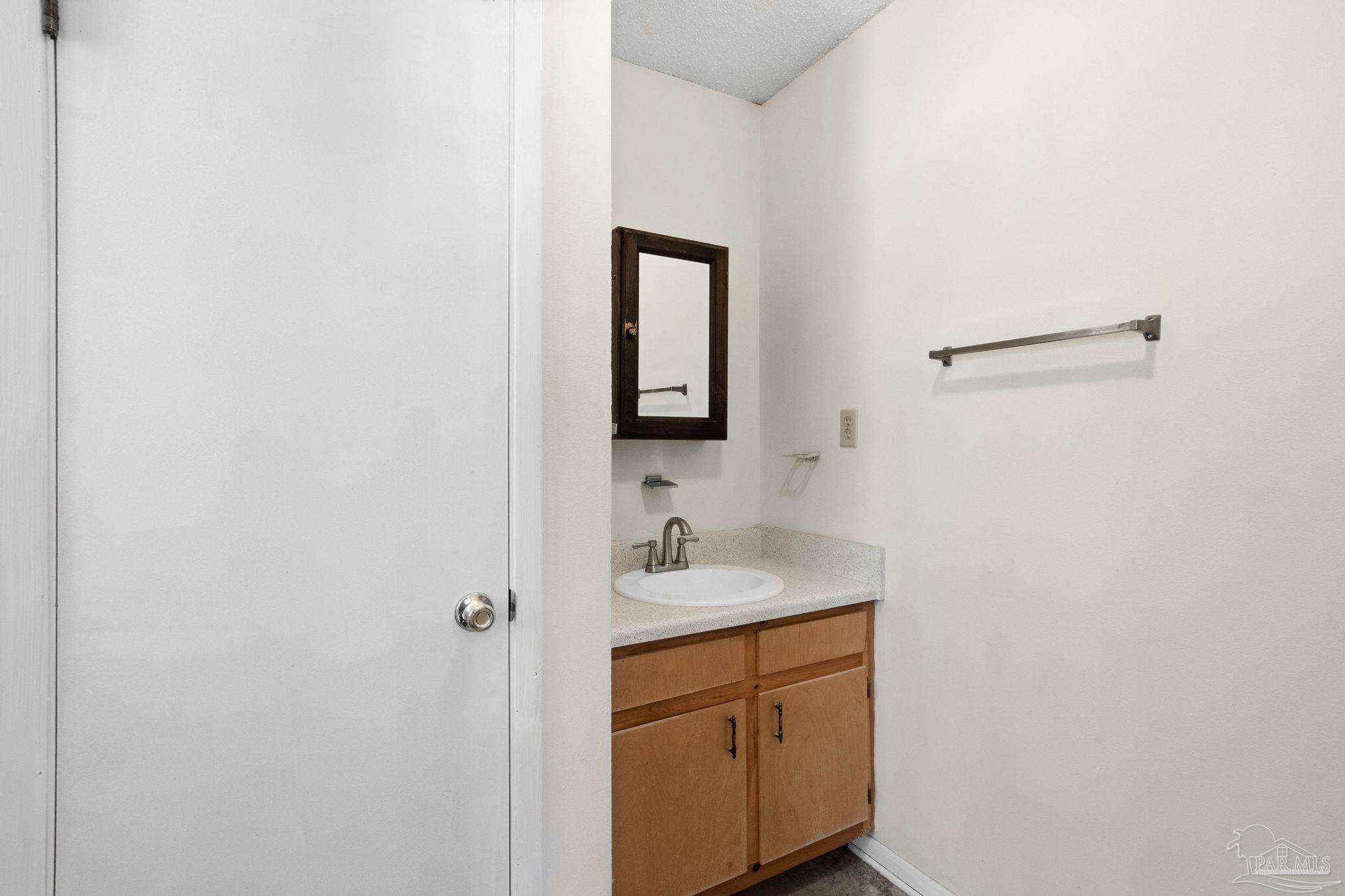 104 Thorndale Place Atmore, AL 36502 - Photo 20 of 39 a bathroom with a sink and a mirror