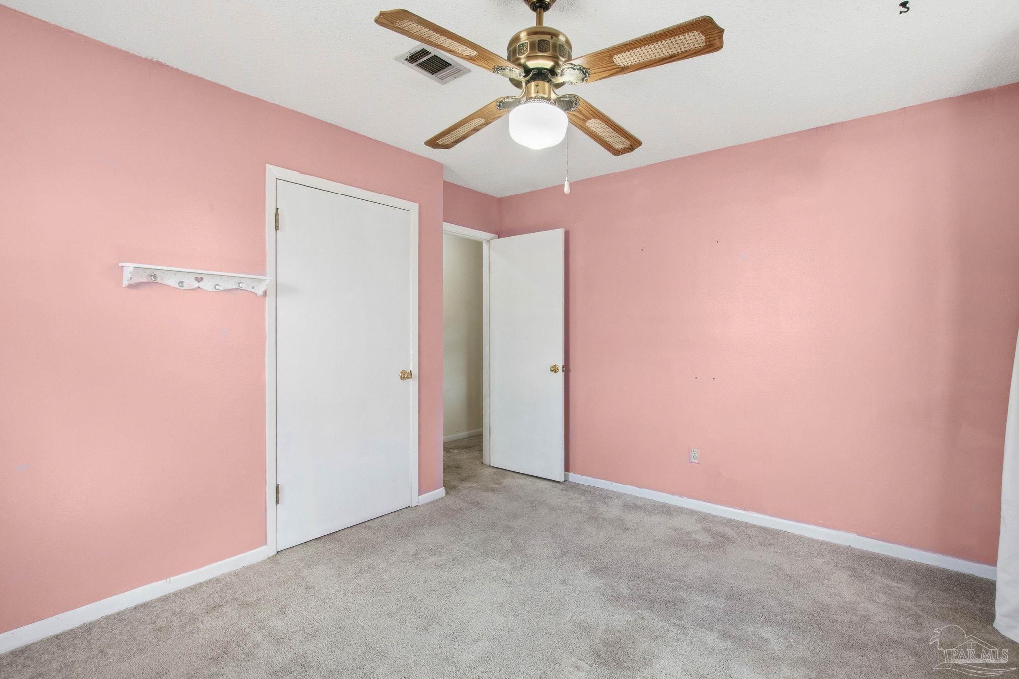 104 Thorndale Place Atmore, AL 36502 - Photo 23 of 39 an empty room with a fan and a fan