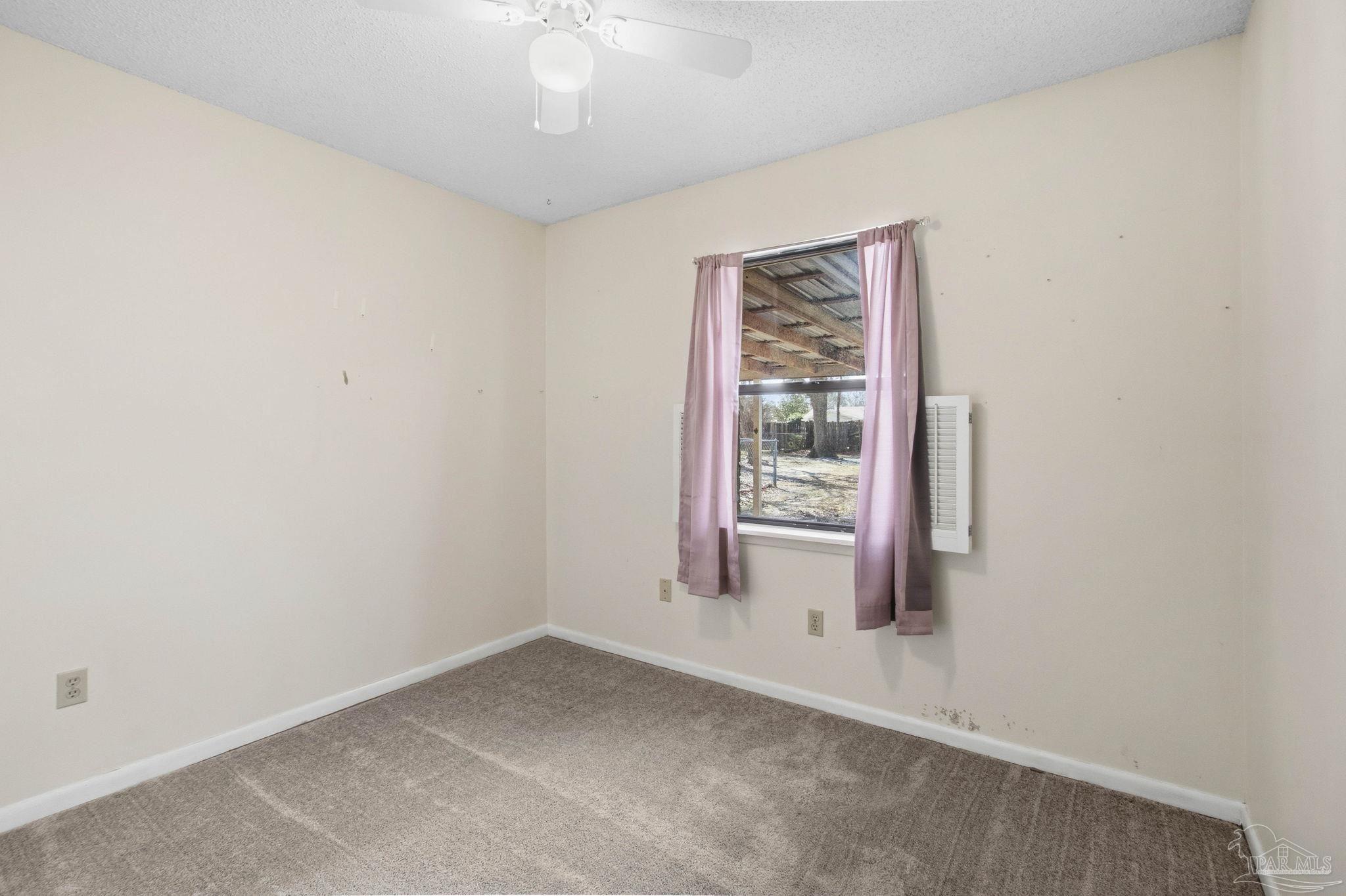 104 Thorndale Place Atmore, AL 36502 - Photo 24 of 39 an empty room with windows