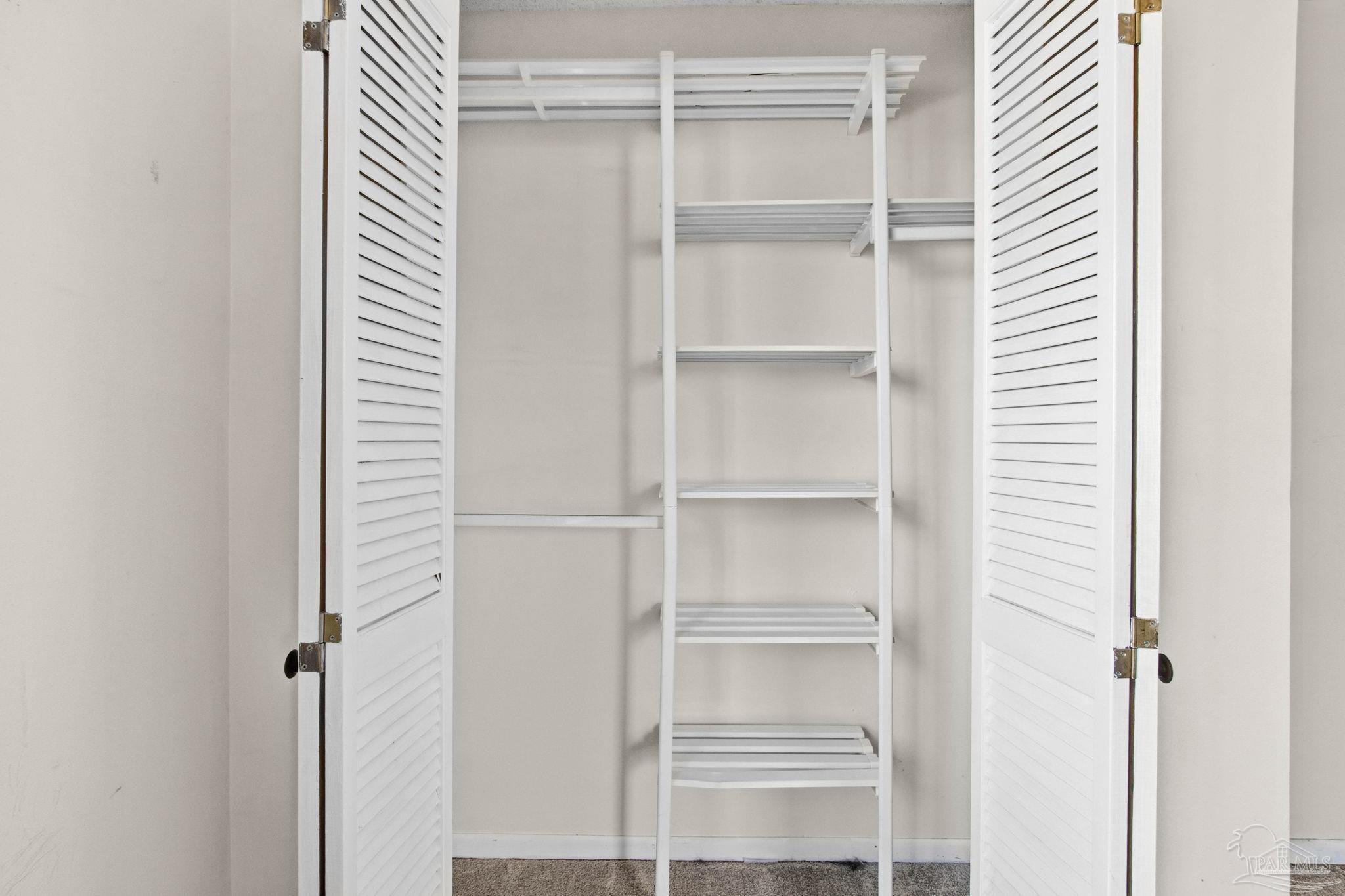 104 Thorndale Place Atmore, AL 36502 - Photo 27 of 39 a view of a room with rack on the wall