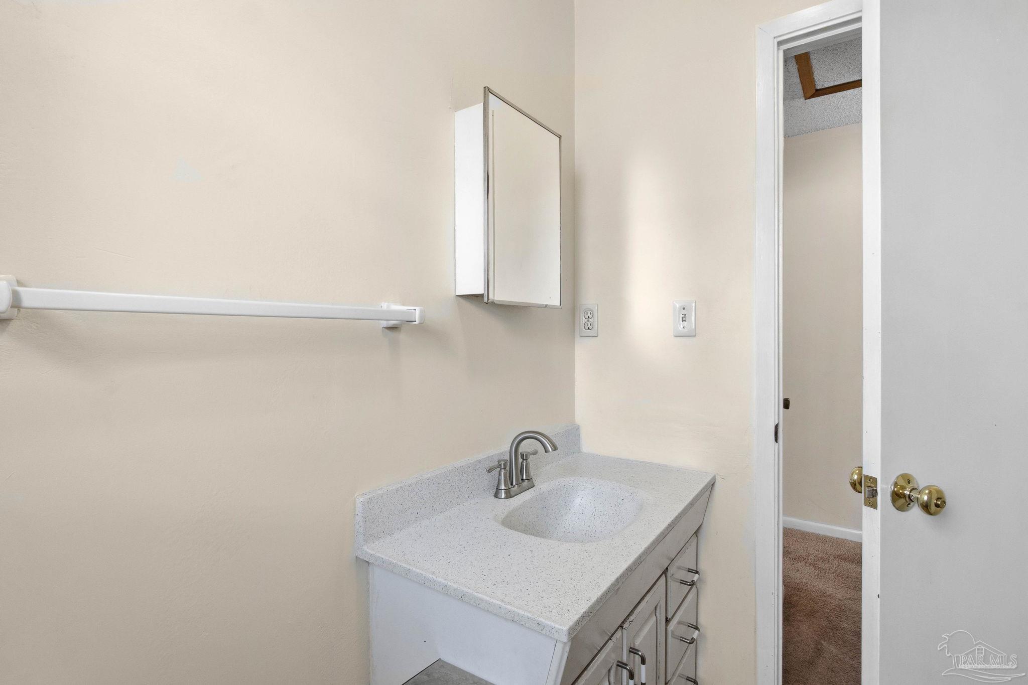 104 Thorndale Place Atmore, AL 36502 - Photo 29 of 39 a bathroom with a sink and a mirror