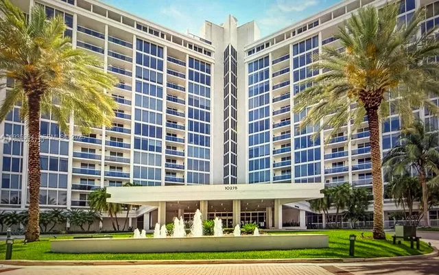 a view of a building with a yard