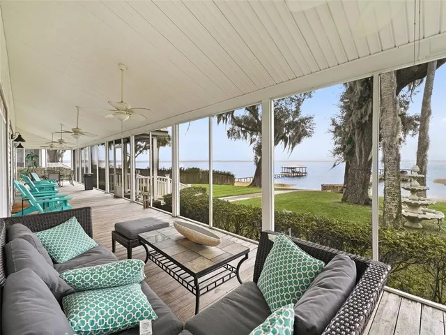 a view of a dining room with furniture wooden floor and chandelier