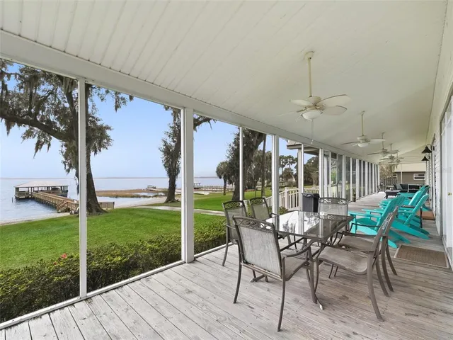 a living room with fireplace furniture and a wooden floor