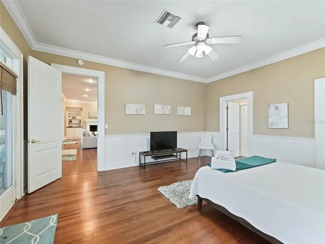 a living room with fireplace furniture and a wooden floor