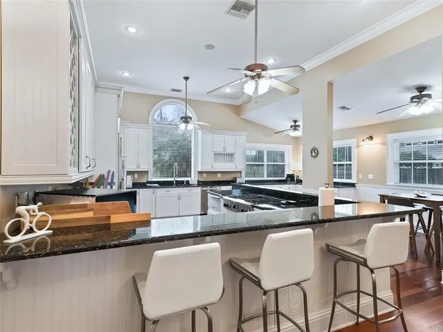 a bathroom with a sink shower and a mirror
