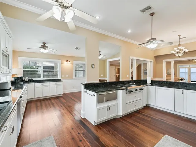 a bedroom with a bed rug and wooden floor