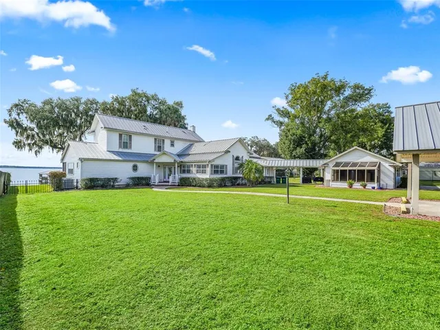 a living room with furniture fireplace and a flat screen tv
