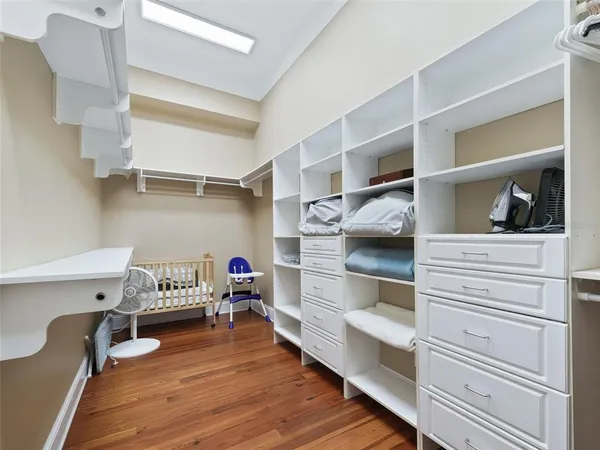 a view of a studio with wooden floor