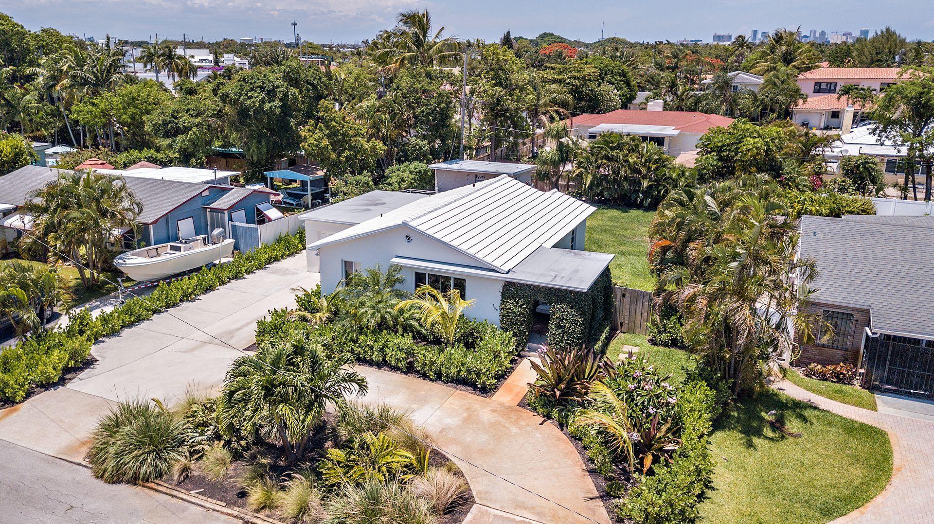 359 Ellamar Road West Palm Beach, FL 33405 - Photo 1 of 28 an aerial view of a house with a garden