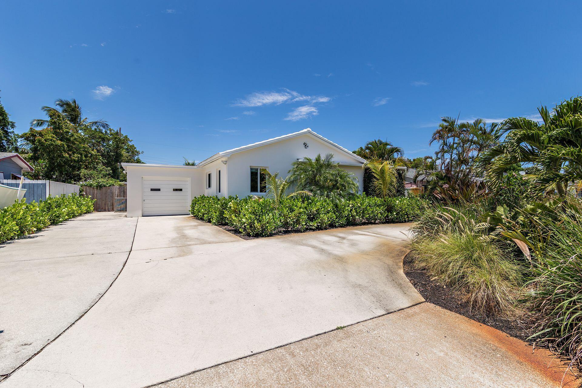 359 Ellamar Road West Palm Beach, FL 33405 - Photo 13 of 28 a view of a house with a yard and plants