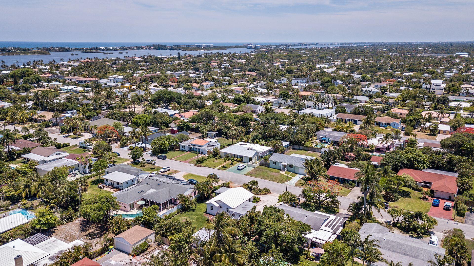 359 Ellamar Road West Palm Beach, FL 33405 - Photo 18 of 28 an aerial view of a city with lots of residential buildings