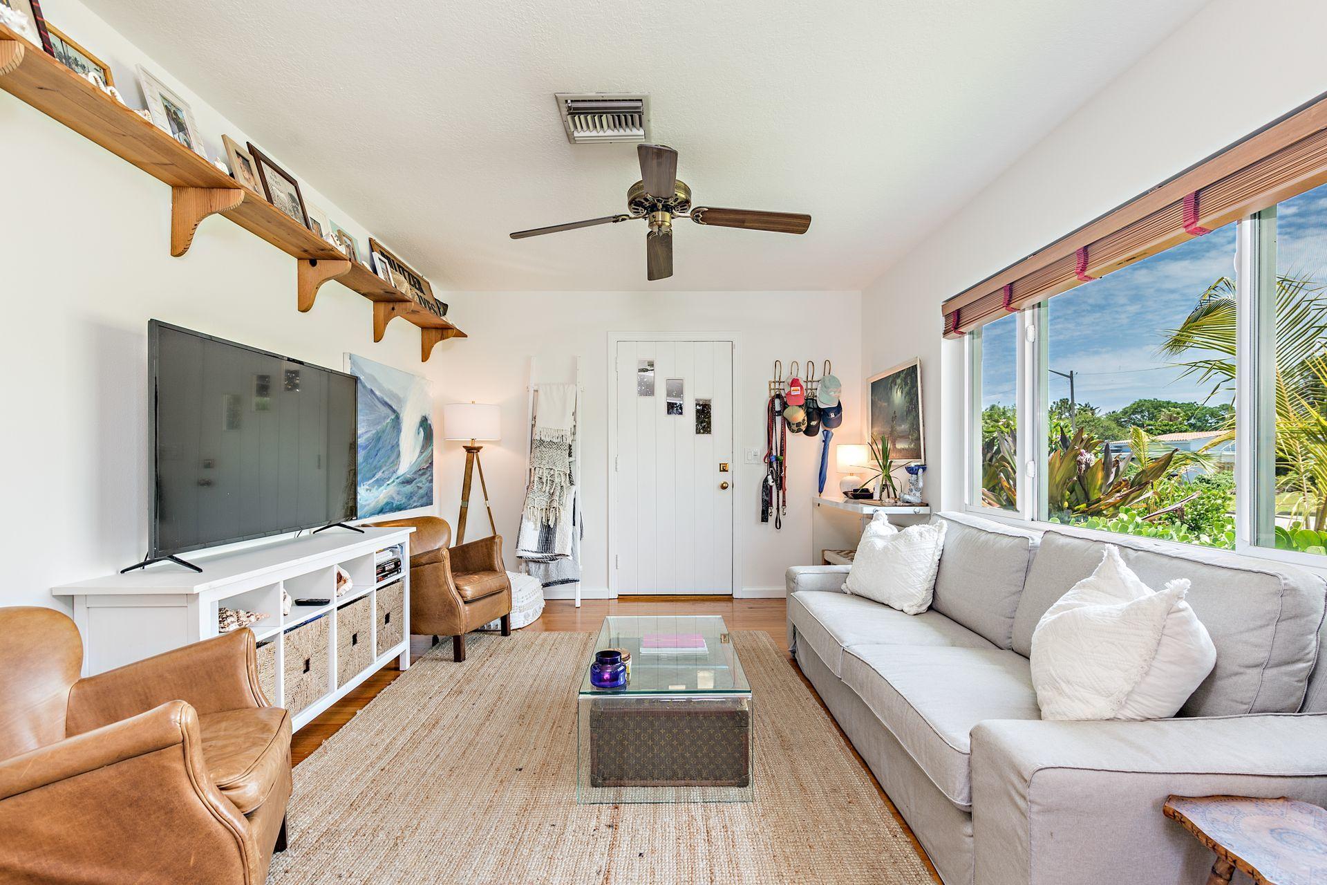 359 Ellamar Road West Palm Beach, FL 33405 - Photo 3 of 28 a living room with furniture and a flat screen tv