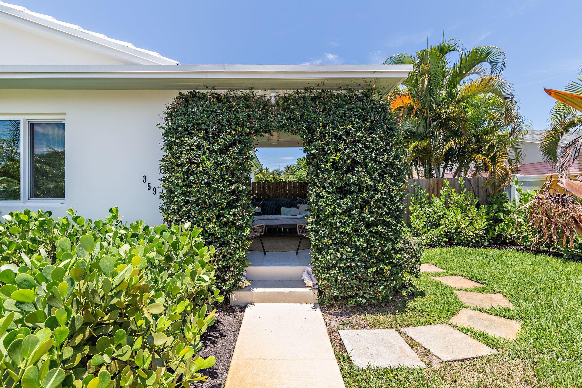 359 Ellamar Road West Palm Beach, FL 33405 - Photo 23 of 28 a view of a pathway both side of the house