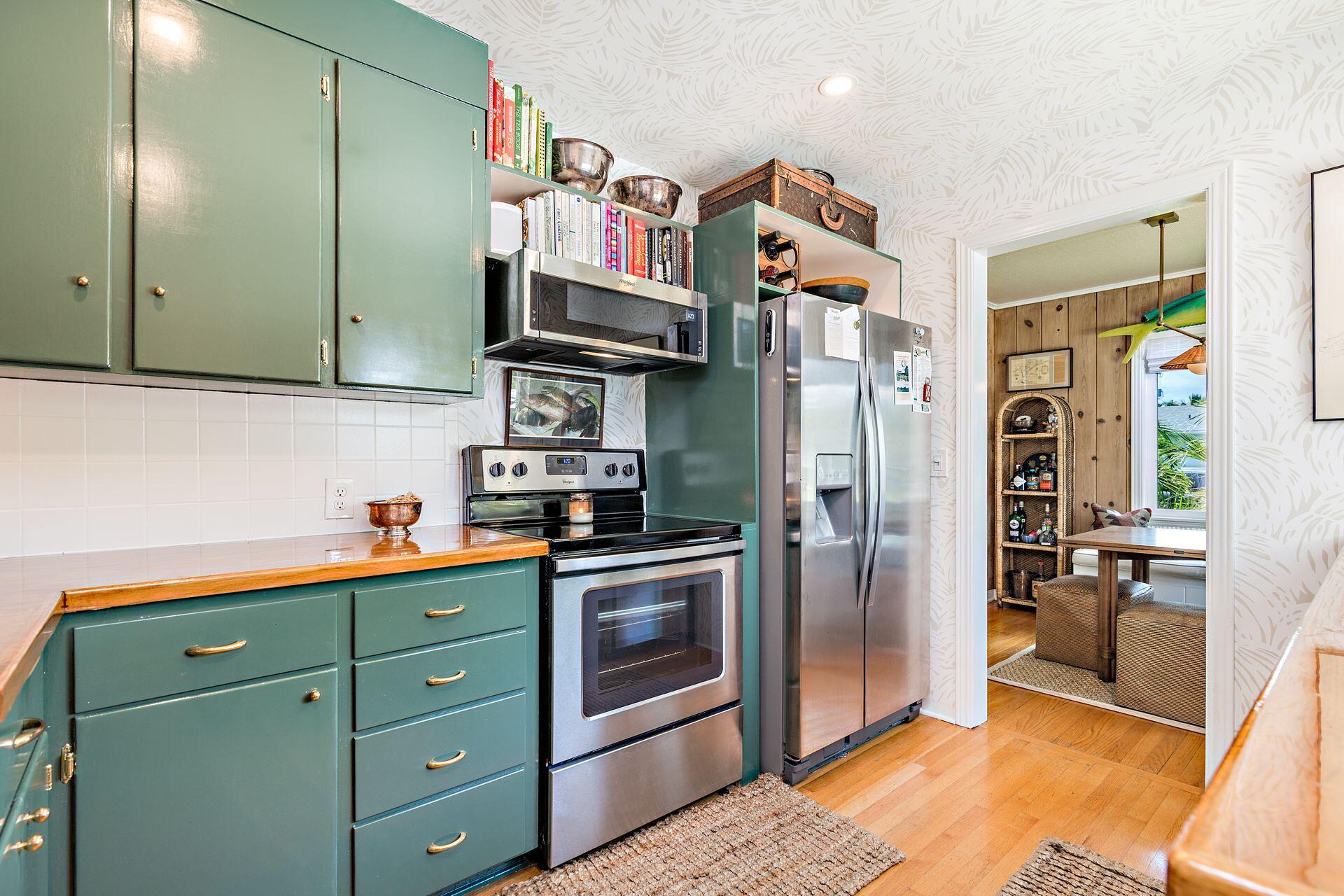 359 Ellamar Road West Palm Beach, FL 33405 - Photo 7 of 28 a kitchen with stainless steel appliances granite countertop a refrigerator and a sink
