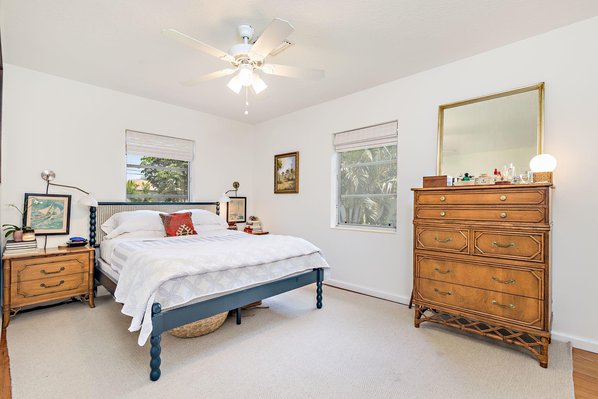 359 Ellamar Road West Palm Beach, FL 33405 - Photo 9 of 28 a bedroom with a bed and a dresser