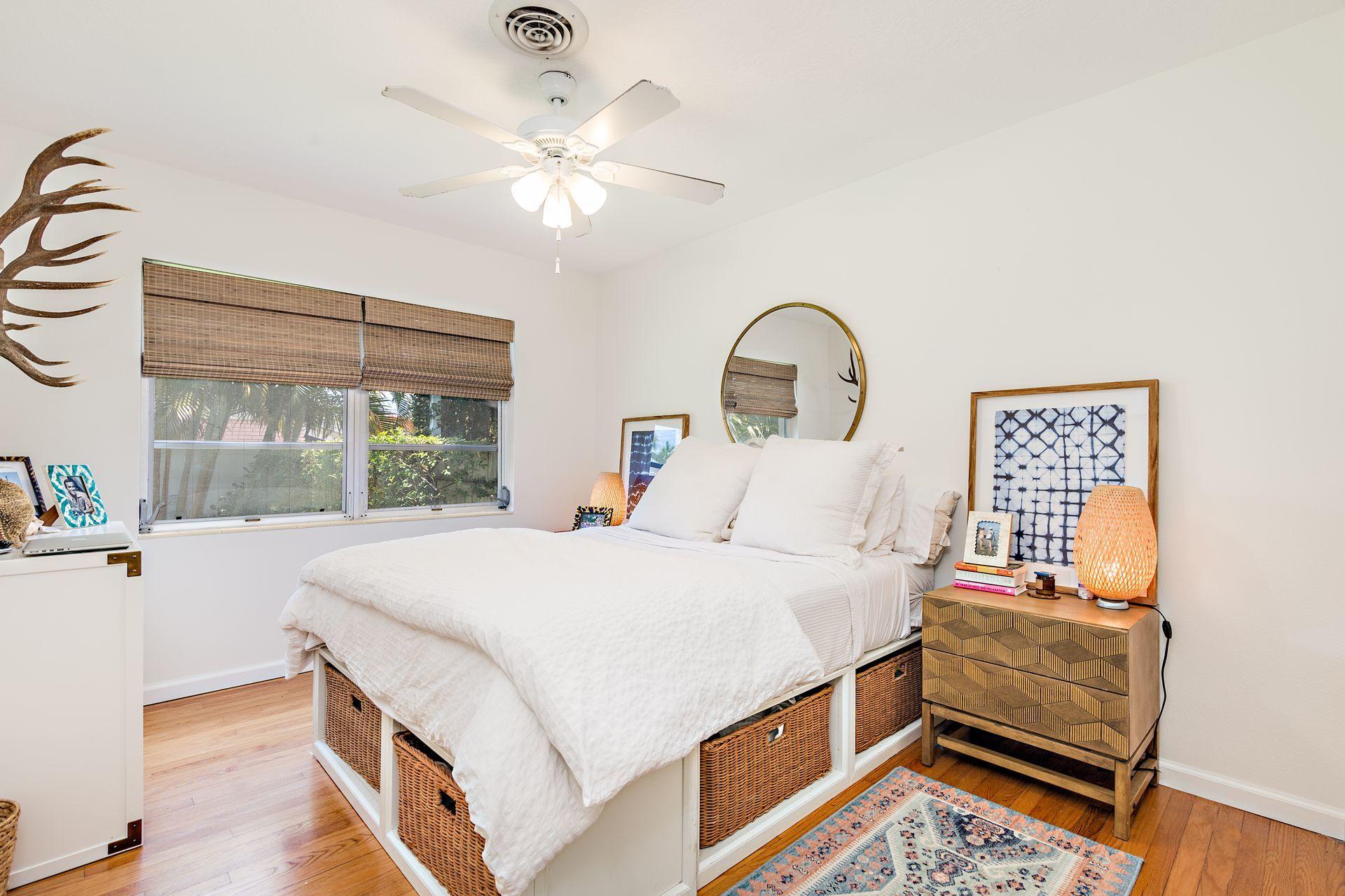359 Ellamar Road West Palm Beach, FL 33405 - Photo 10 of 28 a bedroom with a bed and a large window