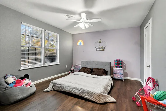 a bedroom with bed and window