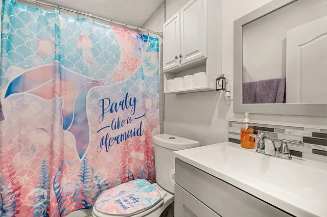 a bathroom with a sink and a toilet