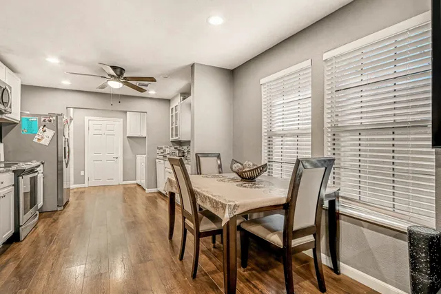 a view of a dining room with furniture and a window