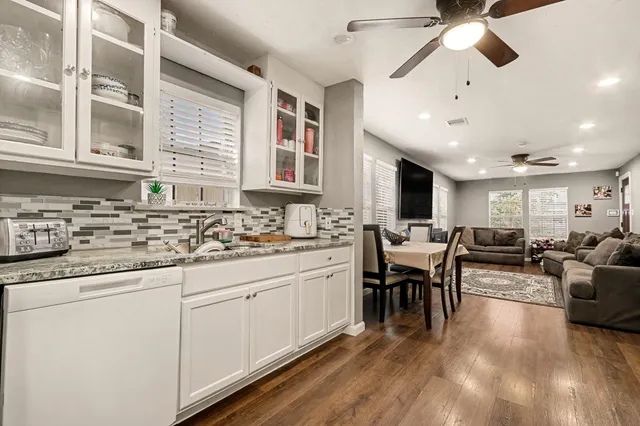 a large white kitchen with lots of counter top space