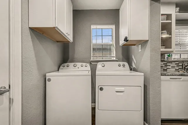 a utility room with dryer and washer