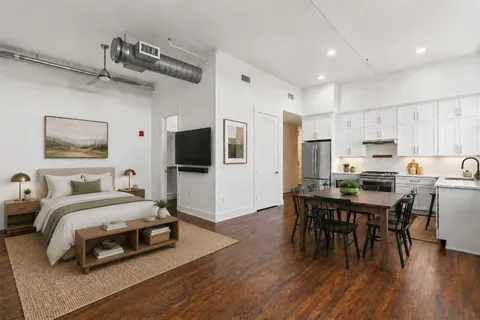 a bedroom with a bed and a table in it