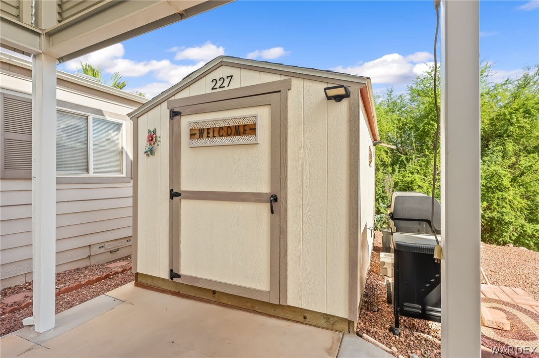 2000 Ramar Road, Unit 227 Bullhead City, AZ 86442 - Photo 16 of 40 Clean, private storage shed with convenient access right off the covered RV port.