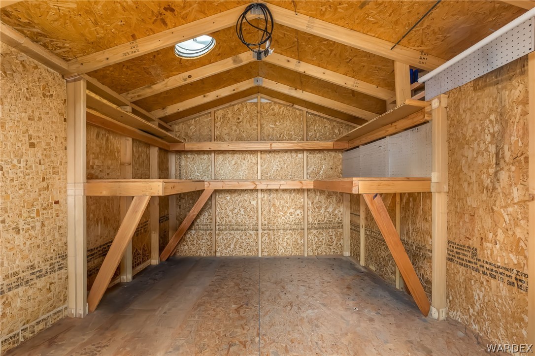 2000 Ramar Road, Unit 227 Bullhead City, AZ 86442 - Photo 17 of 40 nterior of the shed featuring built-in shelving? ideal for organized storage and extra space.