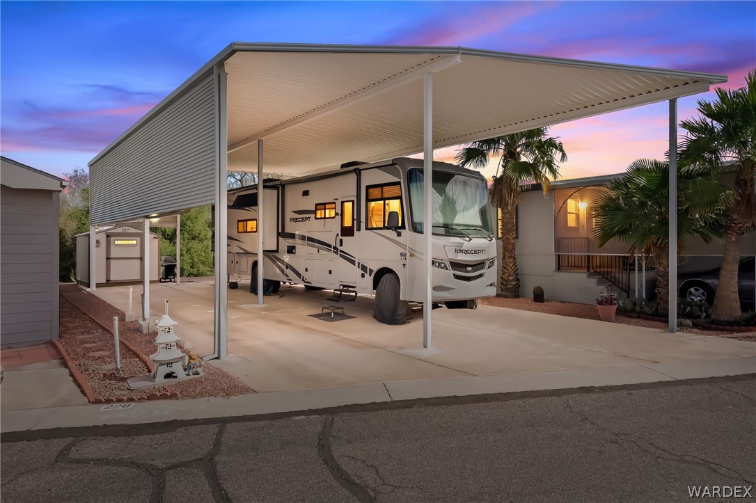 2000 Ramar Road, Unit 227 Bullhead City, AZ 86442 - Photo 2 of 40 Twilight view showcasing the impressive awning coverage?perfect protection and a cozy evening vibe.