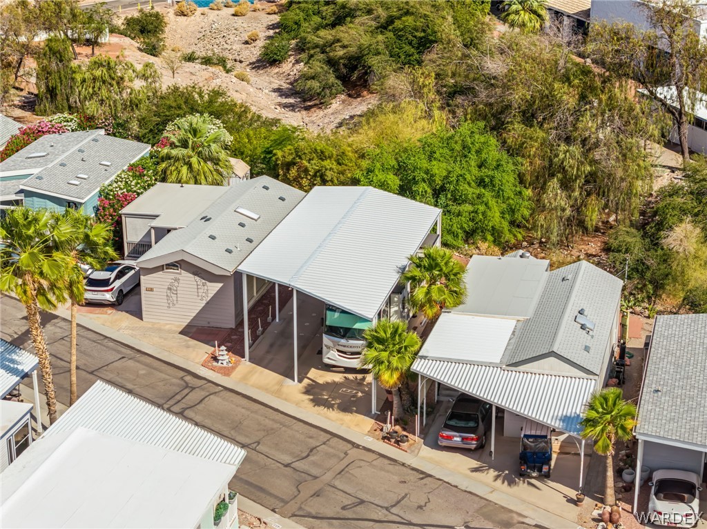 2000 Ramar Road, Unit 227 Bullhead City, AZ 86442 - Photo 10 of 40 Aerial perspective showing the full setup?spacious RV port with upgraded awning and surrounding greenery.