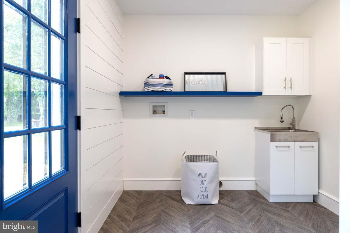 345 Park Avenue Swarthmore, PA 19081 - Photo 21 of 39 Laundry room with large utility sink and storage