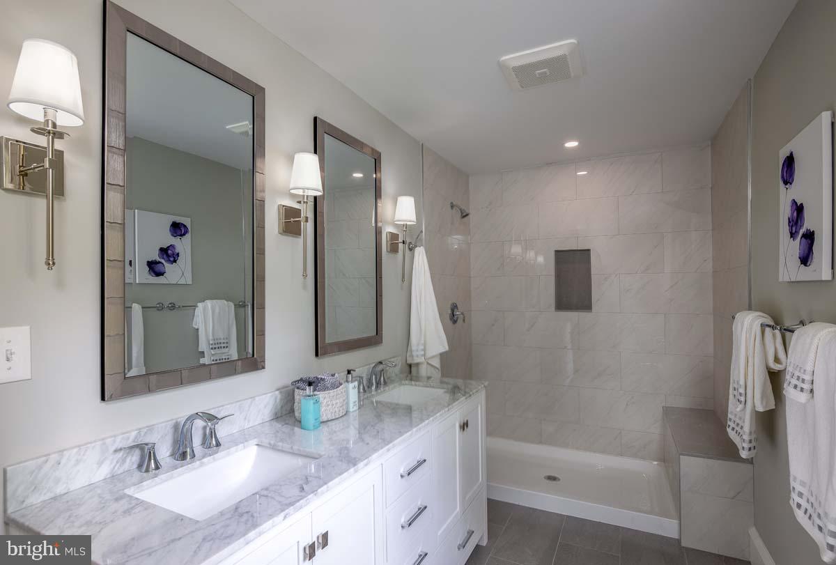 345 Park Avenue Swarthmore, PA 19081 - Photo 31 of 39 Primary bathroom with double vanity and shower