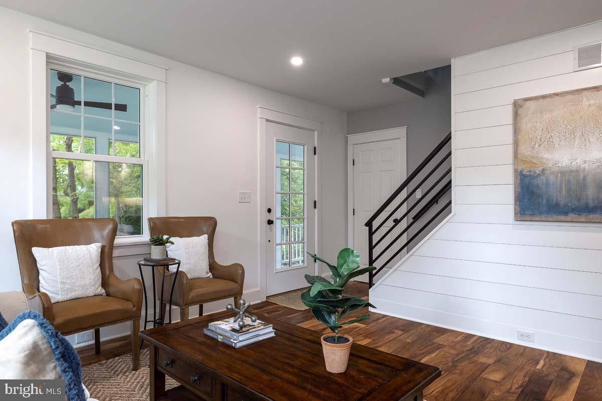 345 Park Avenue Swarthmore, PA 19081 - Photo 8 of 39 Living room with shiplap and custom stair rail