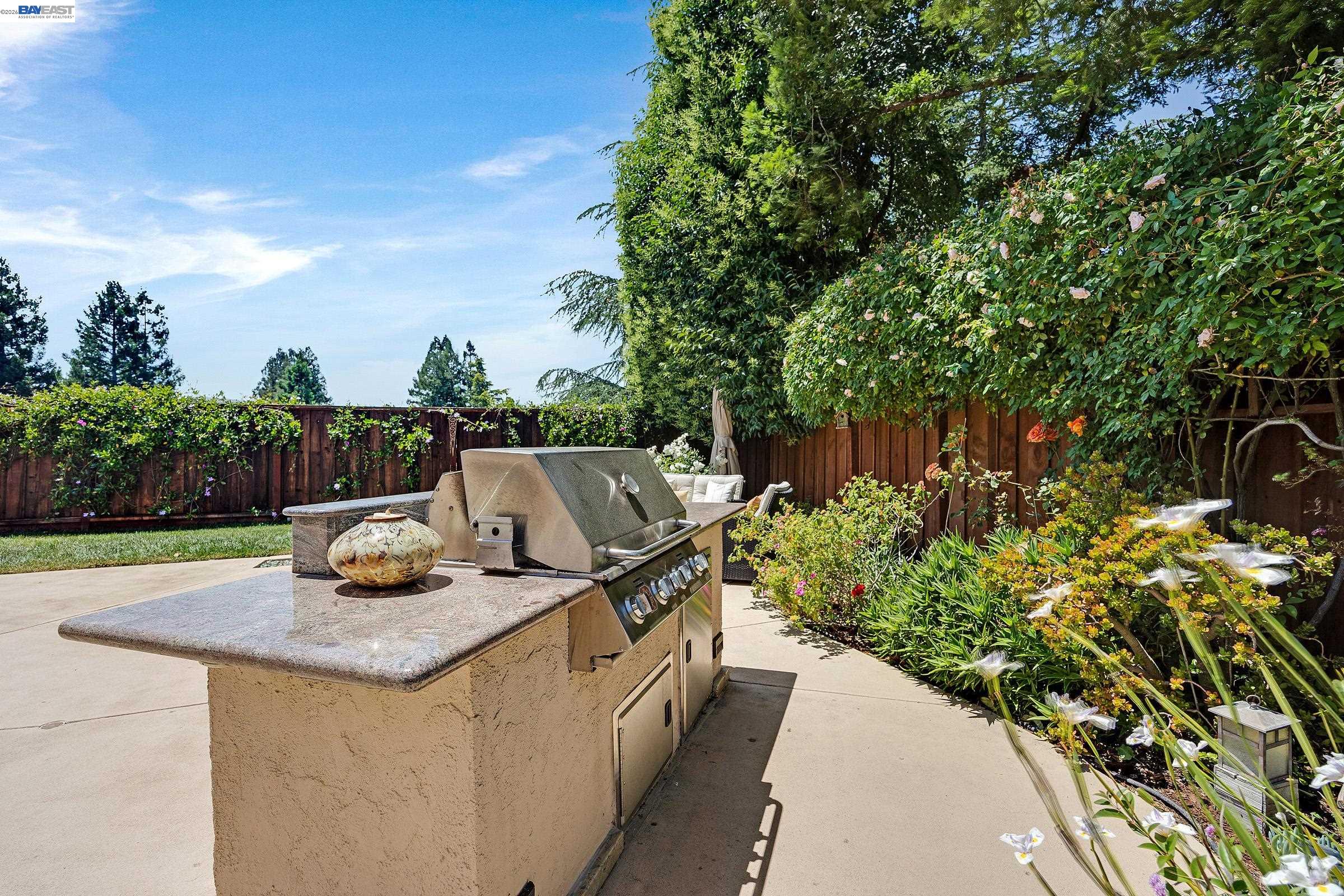 17 Suva Court San Ramon, CA 94582 - Photo 32 of 47 a view of a chairs and table in the backyard