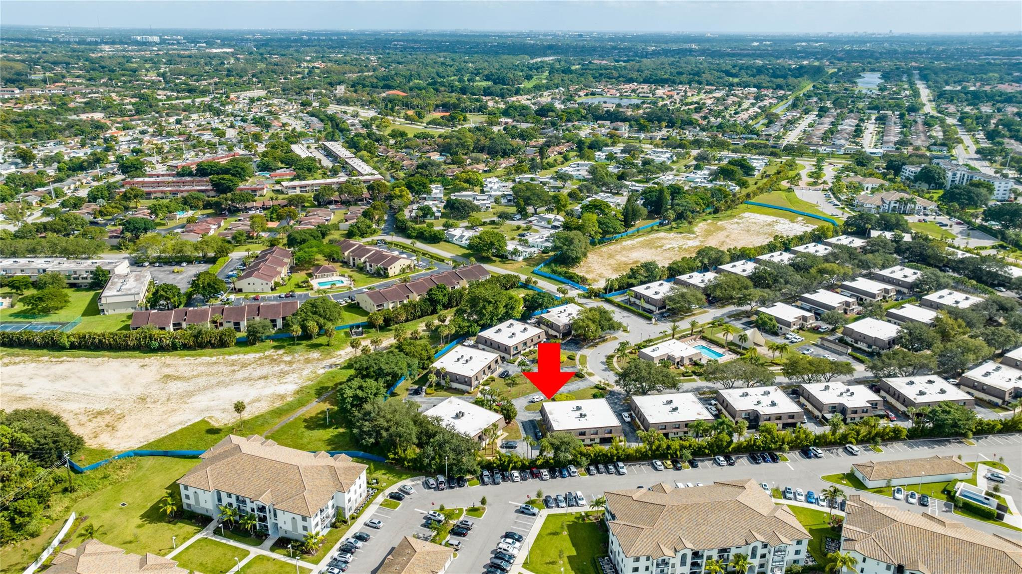 9430 Southwest 61st Way, Unit A Boca Raton, FL 33428 - Photo 30 of 32 an aerial view of residential houses with outdoor space and parking