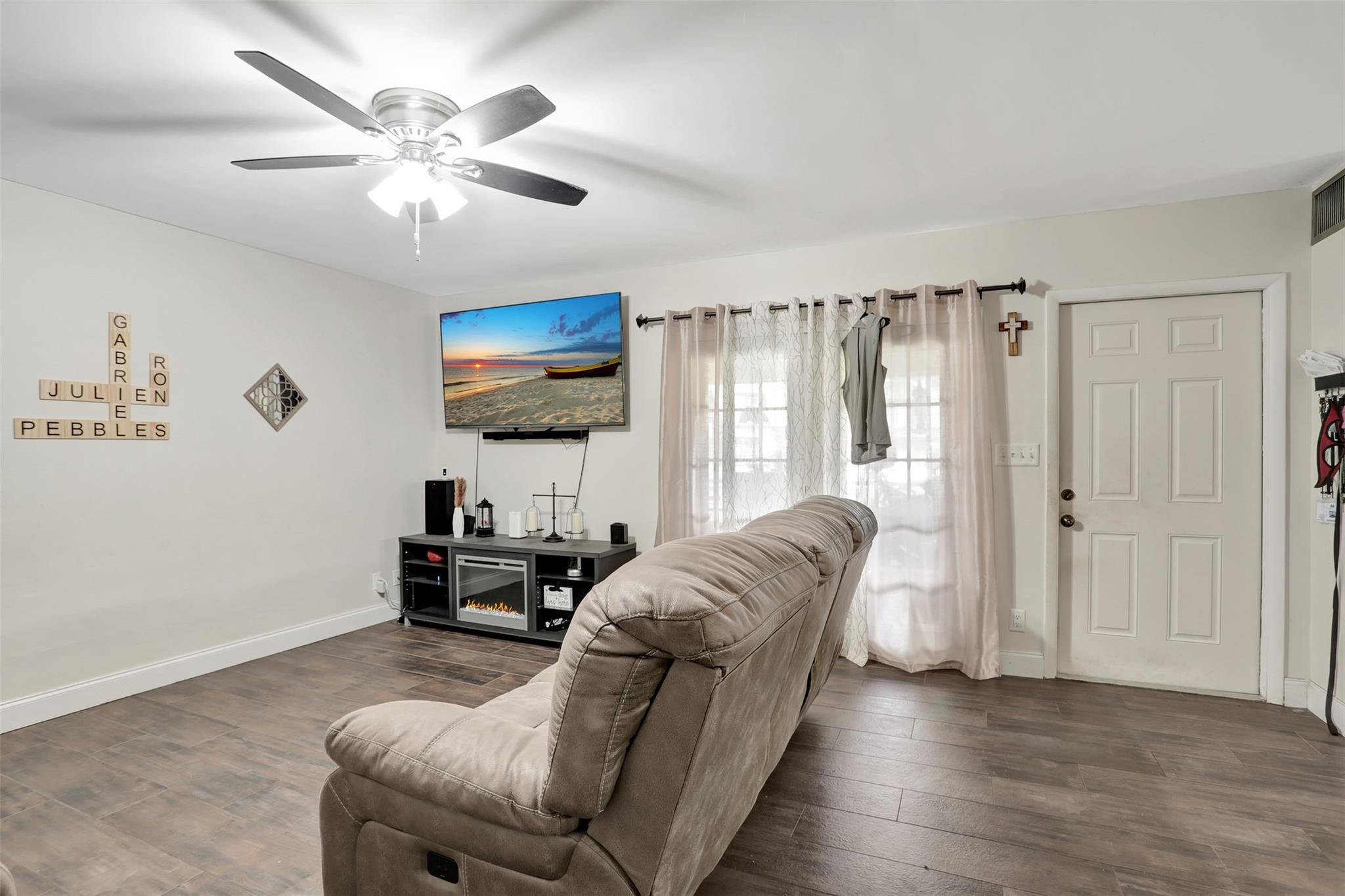 9430 Southwest 61st Way, Unit A Boca Raton, FL 33428 - Photo 9 of 32 a living room with furniture and a large window