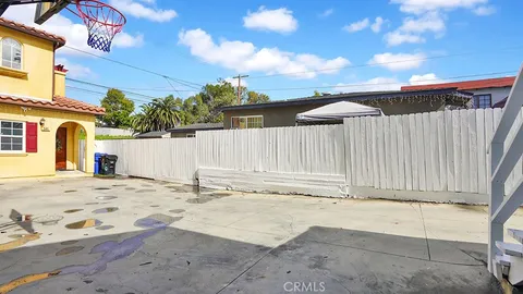 a view of a backyard of the house
