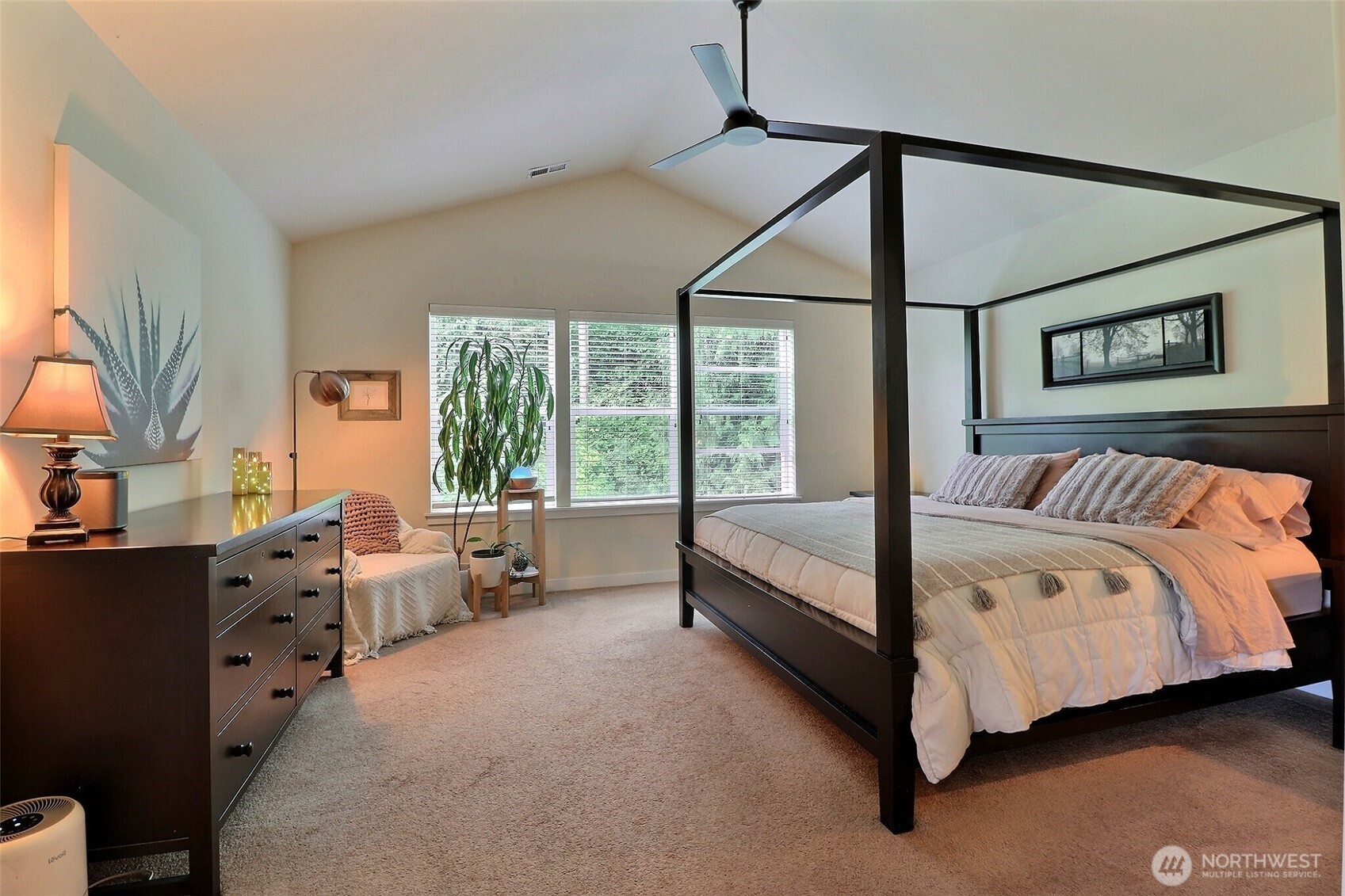 19776 Mountain Ridge Road Southeast Monroe, WA 98272 - Photo 19 of 40 a bedroom with a bed couch and large window