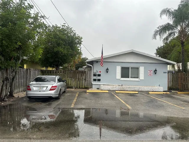 a view of a car park in front of house