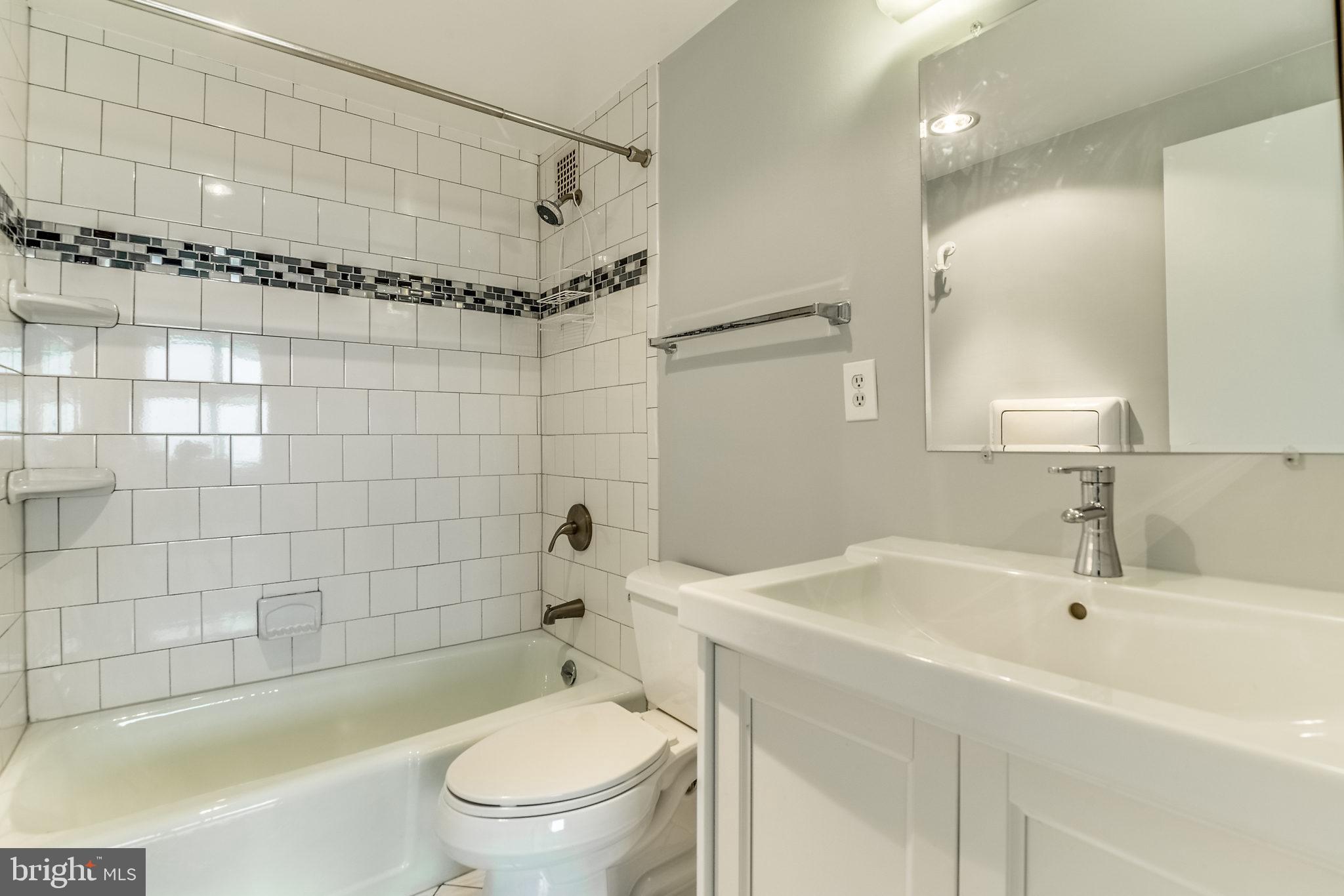 4141 North Henderson Road, Unit 1019 Arlington, VA 22203 - Photo 12 of 27 Modern bathroom with sleek tile accents.