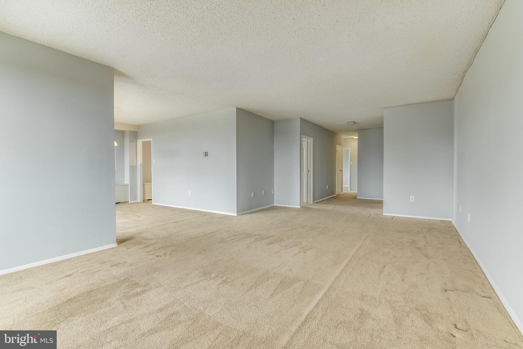 4141 North Henderson Road, Unit 1019 Arlington, VA 22203 - Photo 9 of 27 Spacious, light-filled living area awaits you.